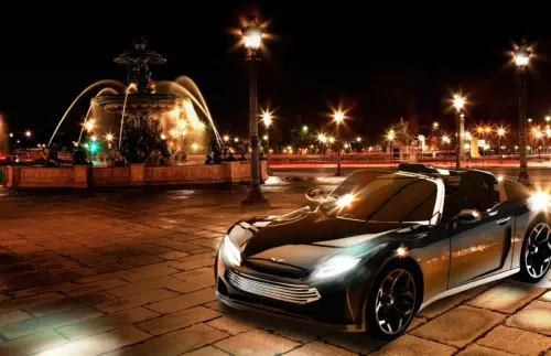 Roadster Pariss Electric de nuit devant une fontaine